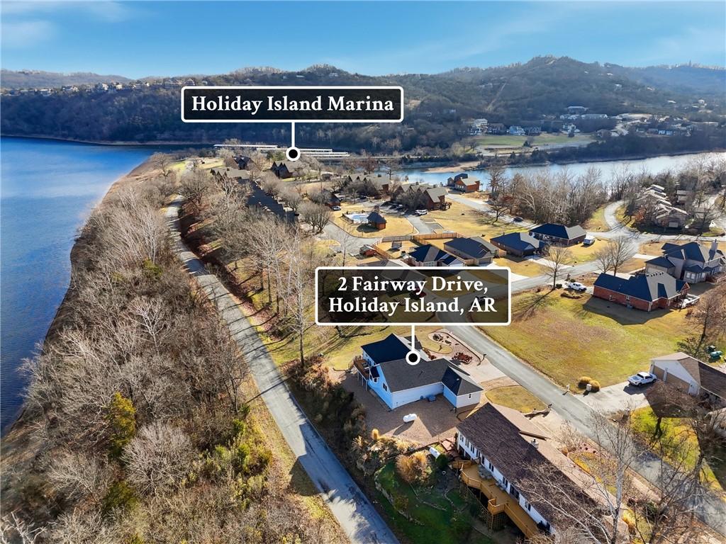 Image 3: Aerial view of property's location with a large bo