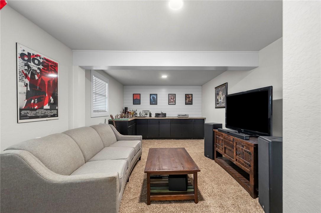 Image 4: Living area featuring light carpet, recessed light