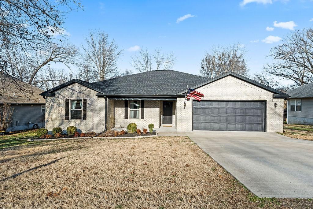 Image 3: Ranch-style home featuring an attached garage, cov