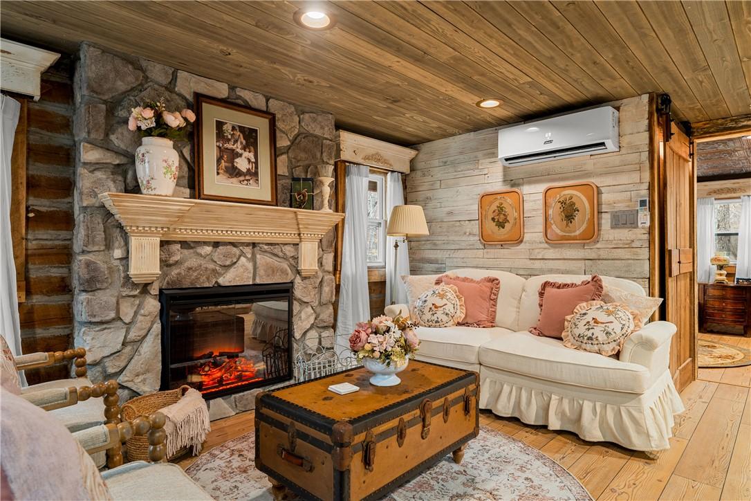 Image 4: Living room with hardwood / wood-style floors, a s