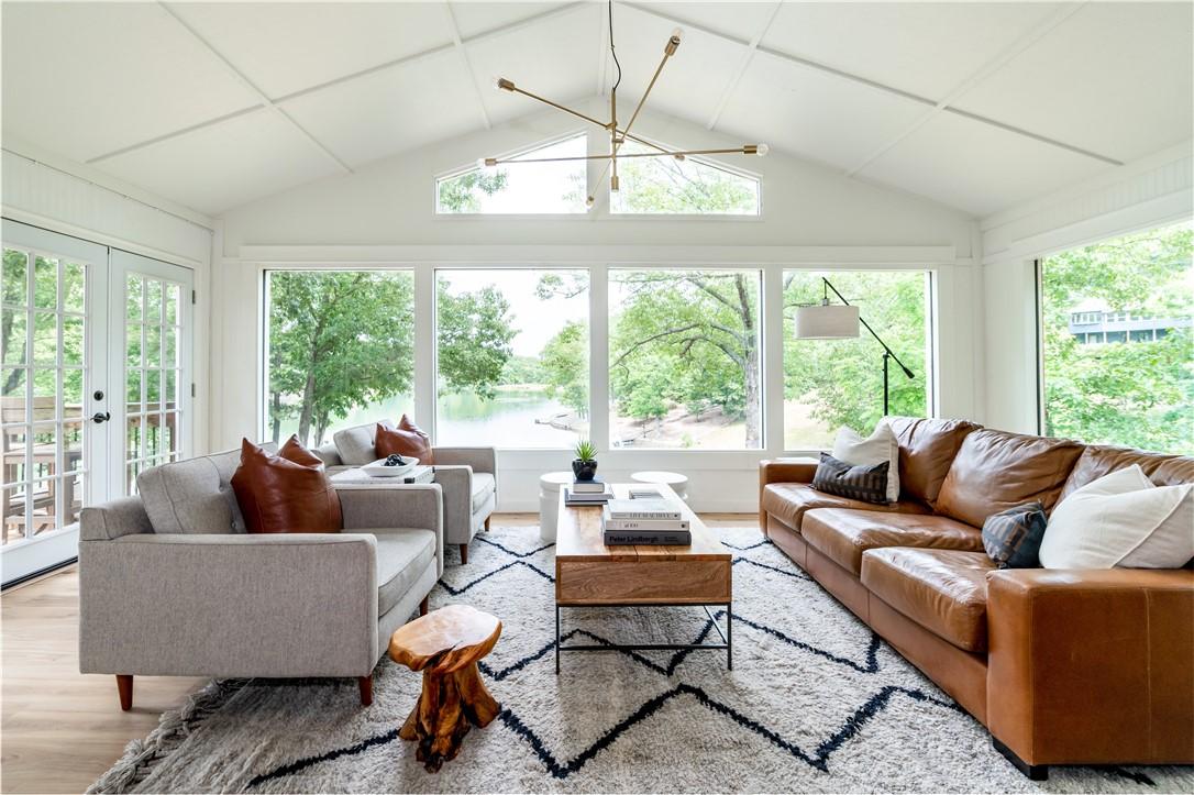 Image 1: Lake views & natural light flood the open living r