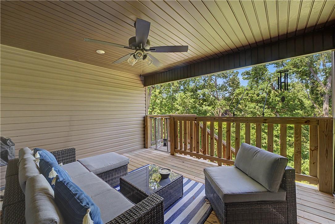Image 2: Covered east facing deck where you can enjoy your