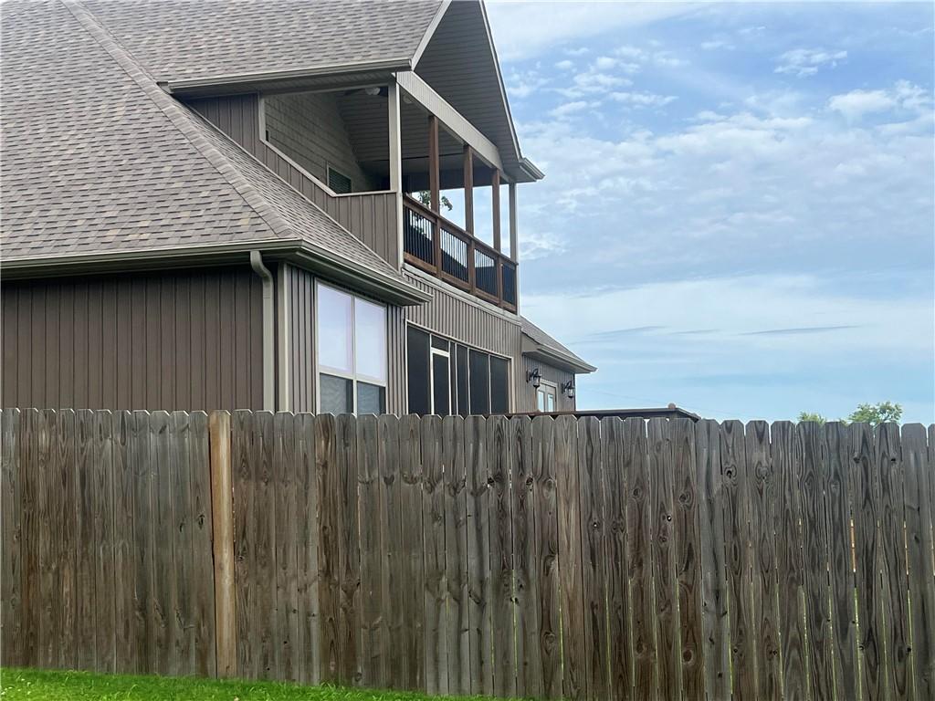 Image 4: Exterior featuring vertical siding and an upper-le