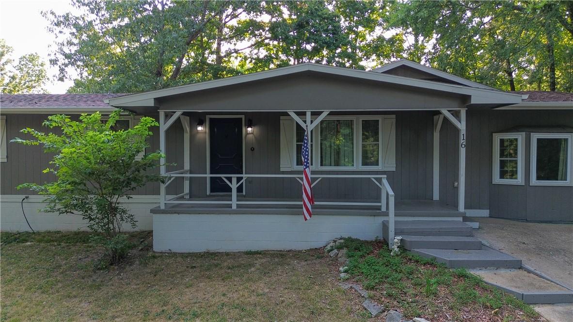 Image 4: Charming single-story residence featuring a covere