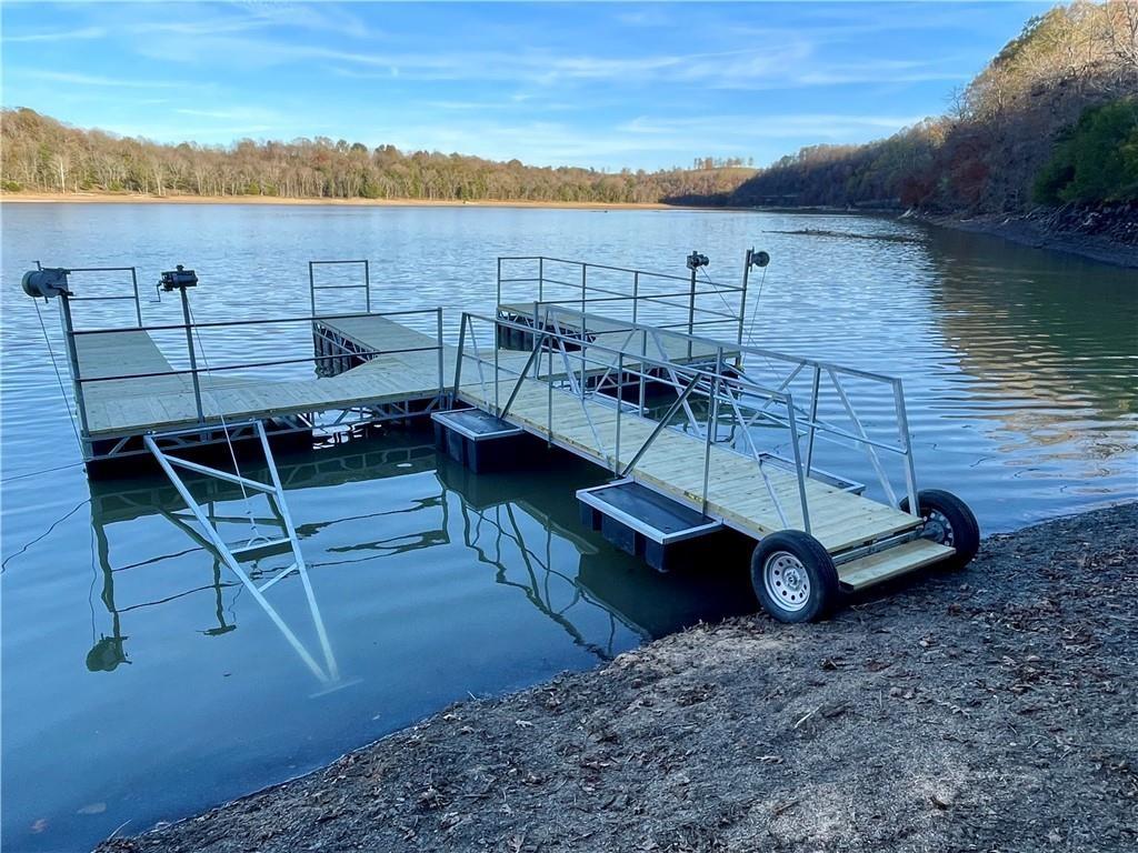 Image 2: Dock with two slips,Beaver Lake and a wooded view