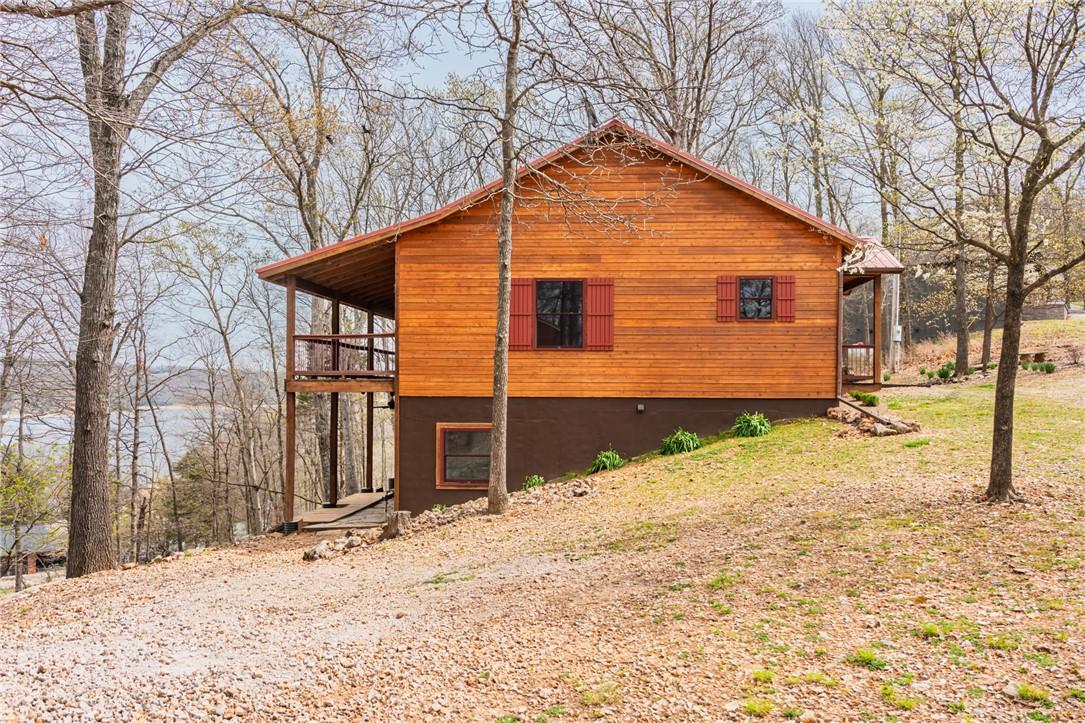 Image 3: Side view of home showing upper and lower-level co