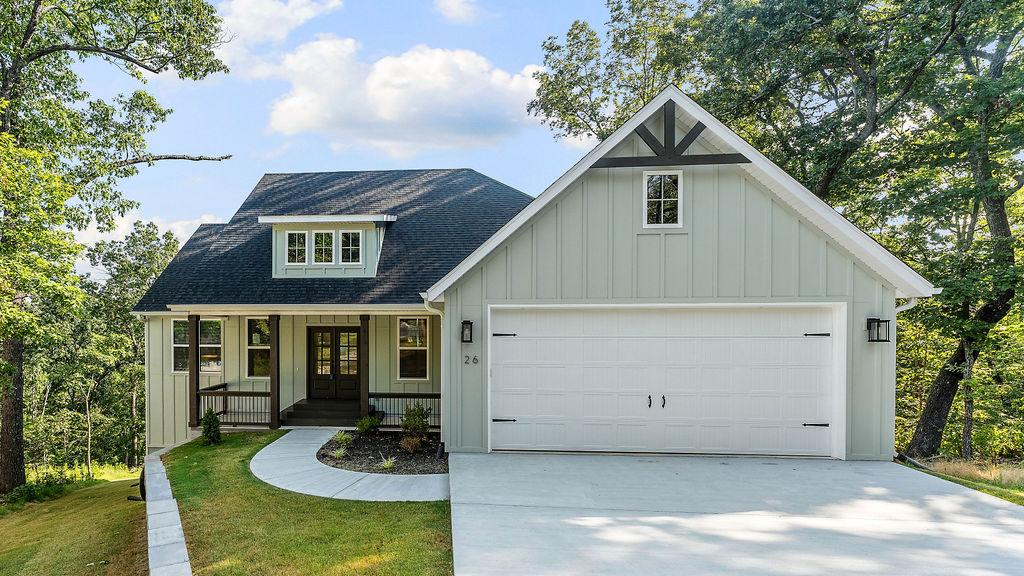 Image 1: Modern farmhouse exterior with a light green verti