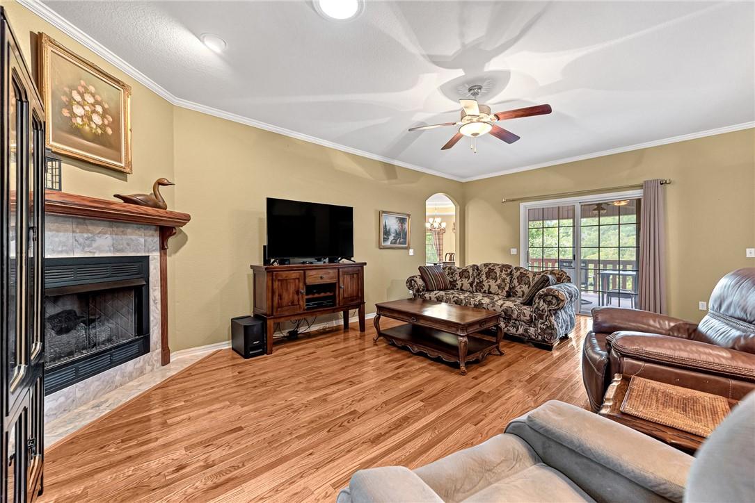 Image 4: living room with wood floors and gas fireplace