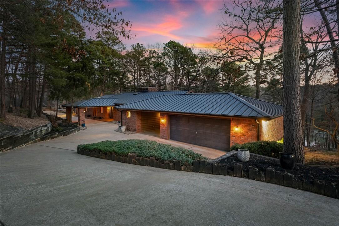 Image 3: 2 car garage + 1 carport space as well as the cove