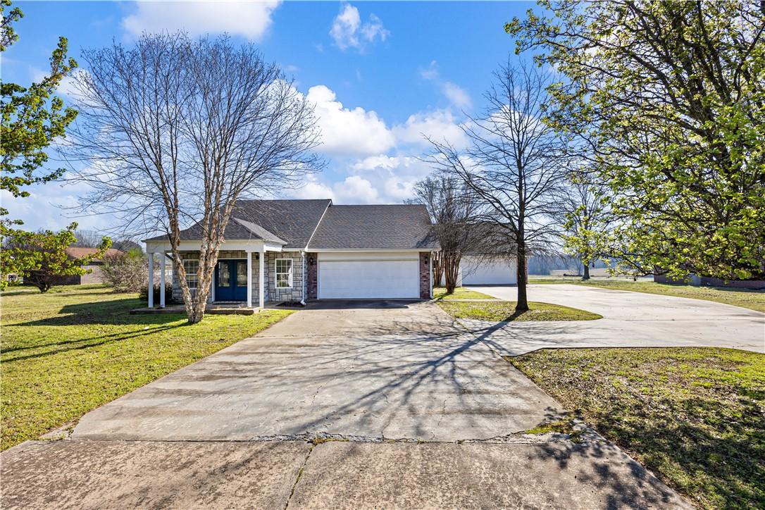 Image 2: View of front of property featuring concrete drive