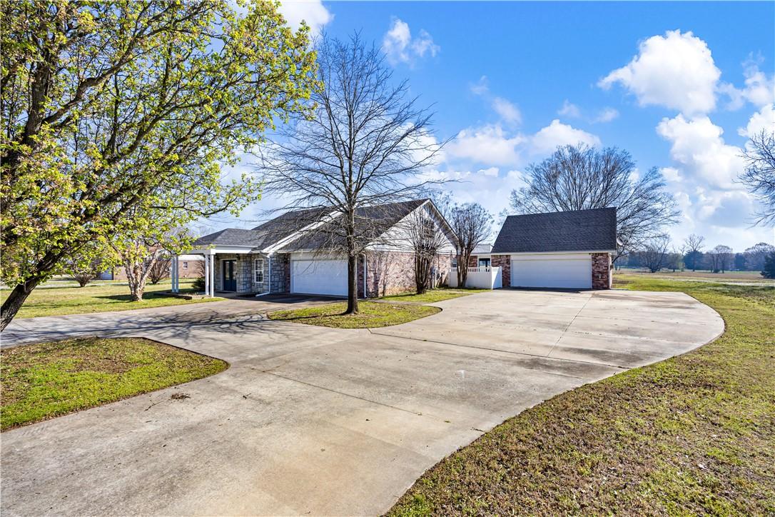 Image 3: View of front of house featuring a front lawn, dri