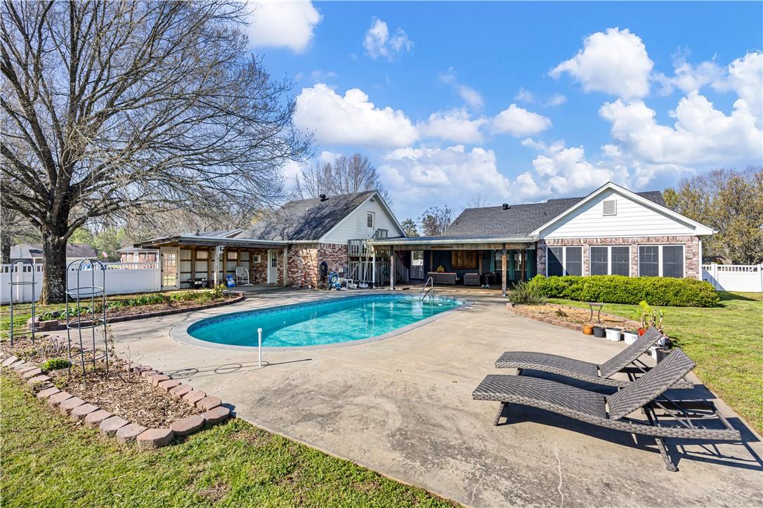 Image 4: View of swimming pool featuring patio surround