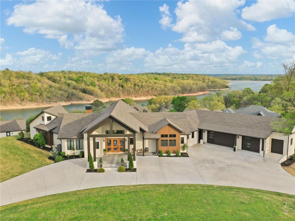 Image 1: Contemporary residence featuring a prominent gable
