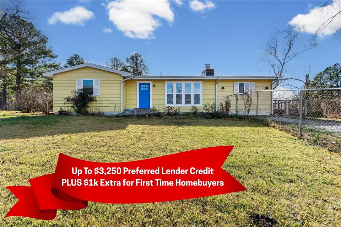 Image 2: View of front of home with a chimney