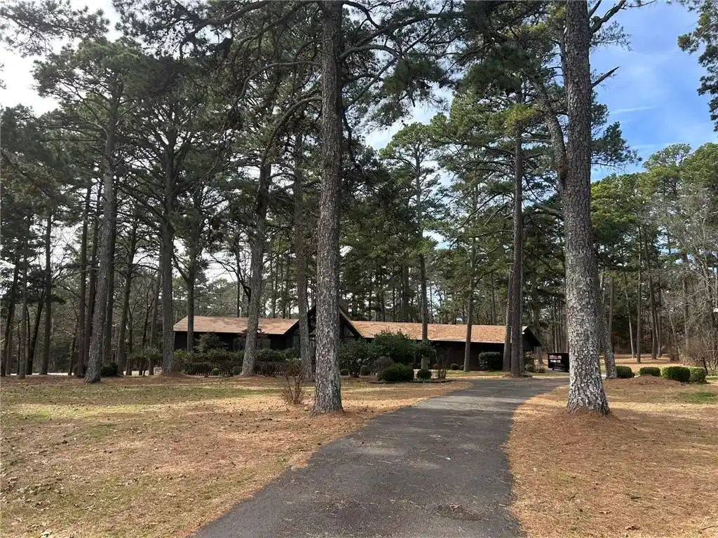 Image 1: Ranch-style home featuring driveway and view of sc