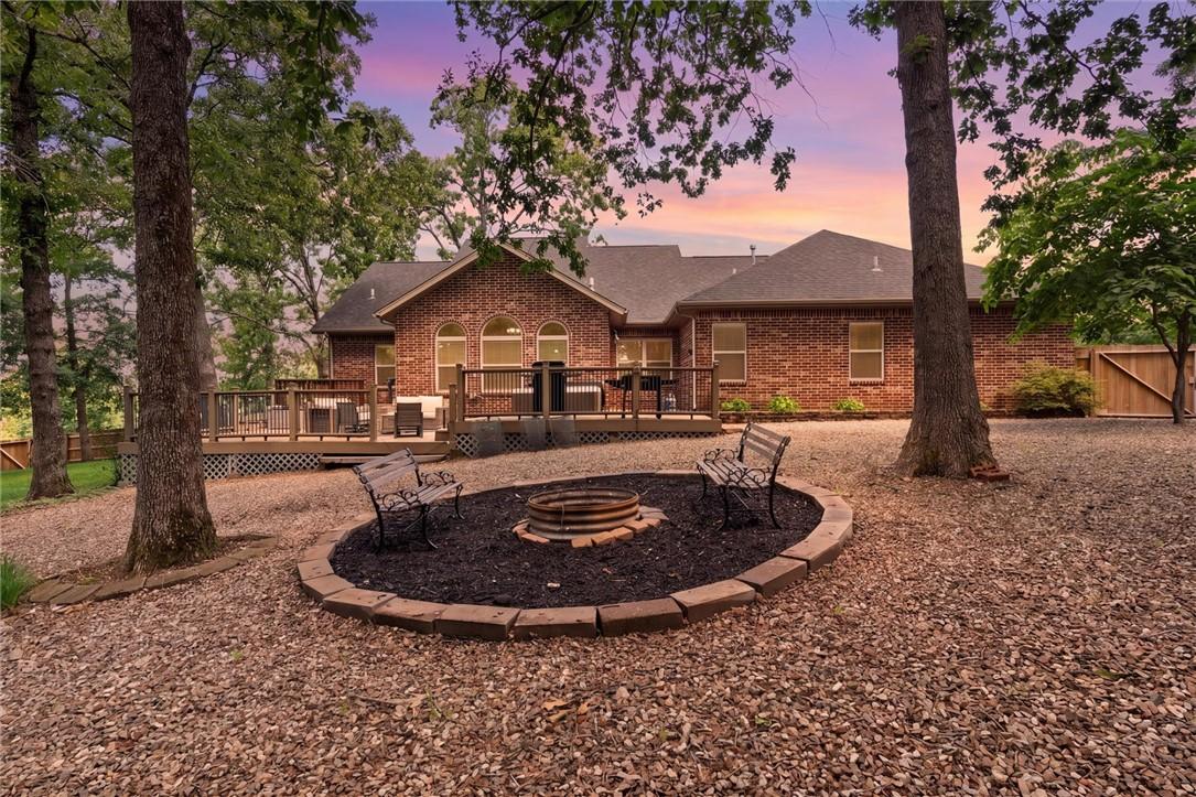 Image 2: Brick exterior property featuring an expansive woo