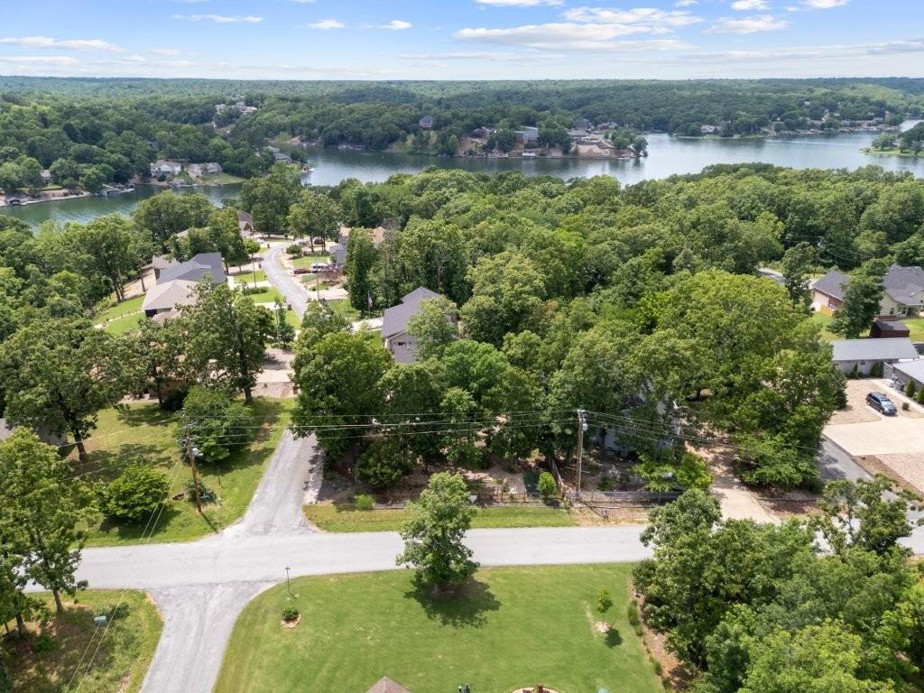 Image 4: Landscaped corner lot has greenhouse and raised ga