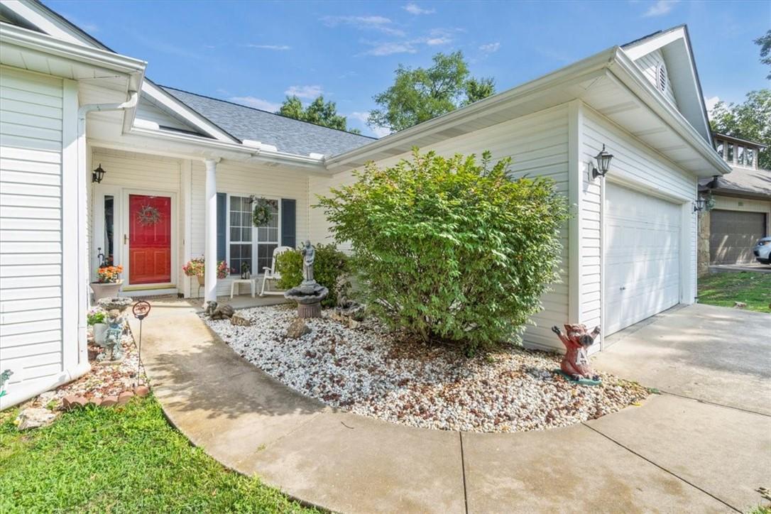 Image 3: Doorway to property with an attached garage, cover