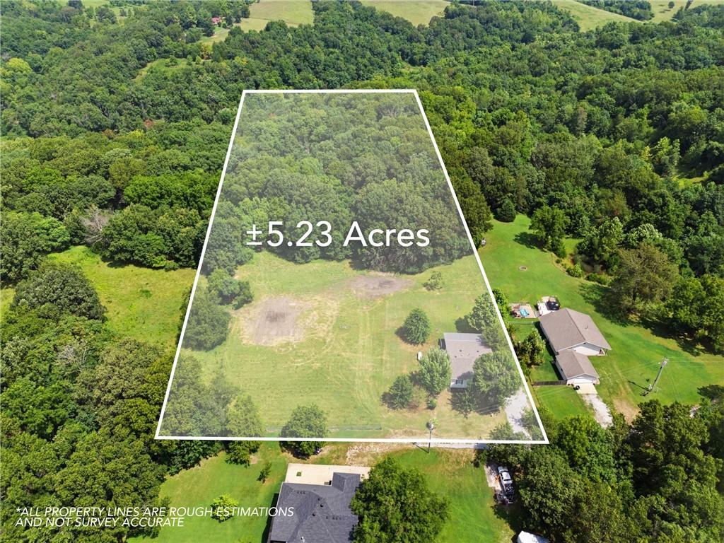 Image 4: Expansive 5.23-acre parcel featuring a mix of open