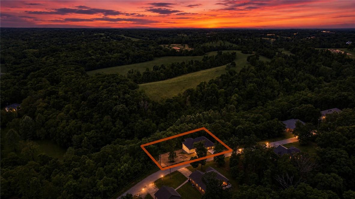 Image 3: Aerial perspective of a property surrounded by mat