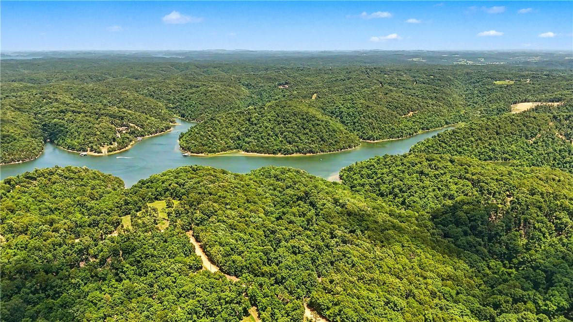 Image 3: Expansive aerial landscape featuring a winding riv