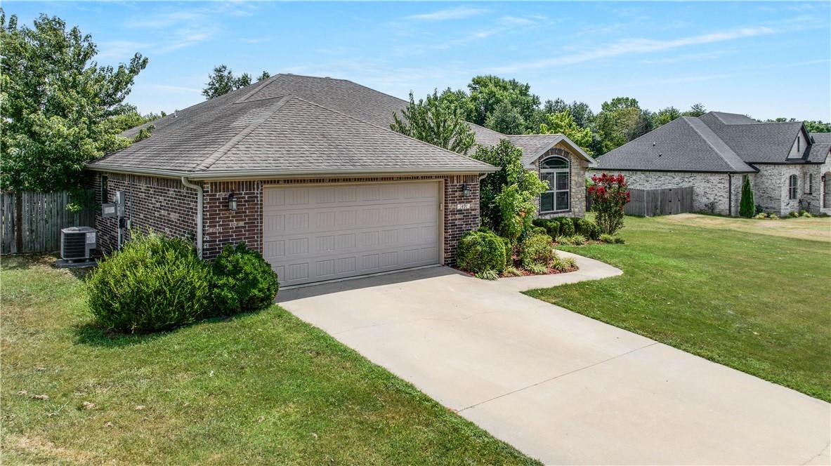 Image 3: An attached two-car garage provides convenient par