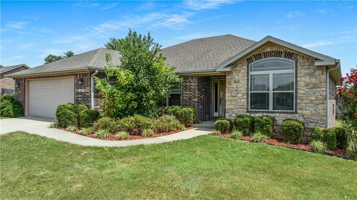 Image 4: Mature landscaping and a welcoming entrance make a