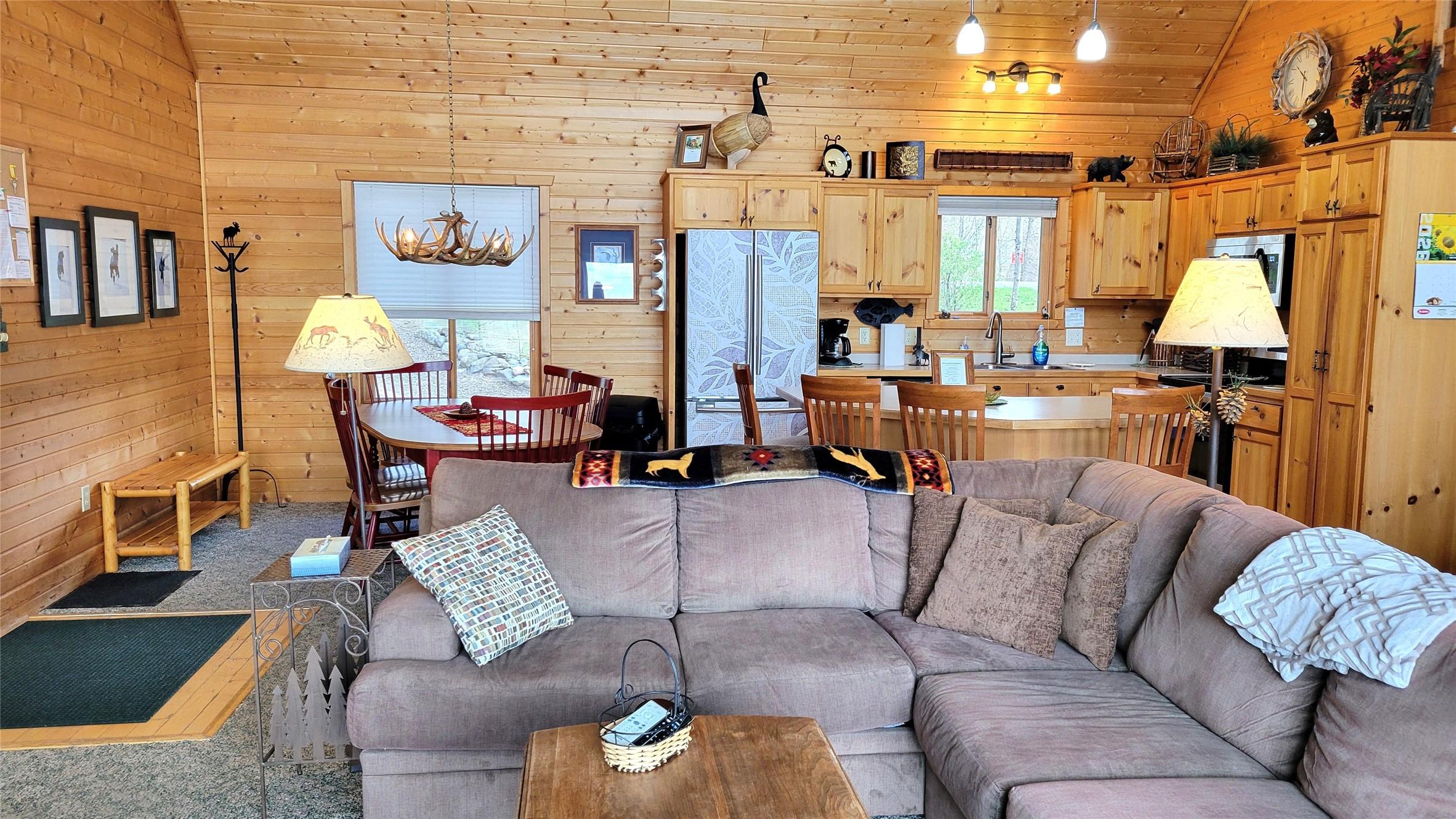 Image 4: Open, vaulted living, dining and kitchen