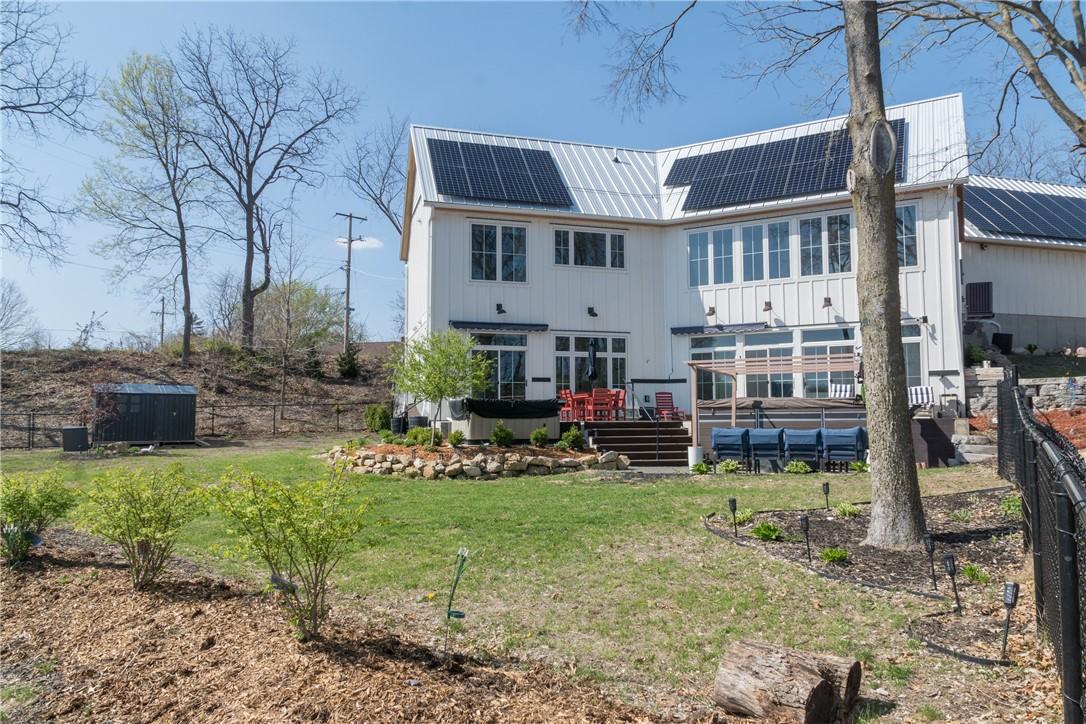 Image 2: Exterior of House & back of property, lake side.