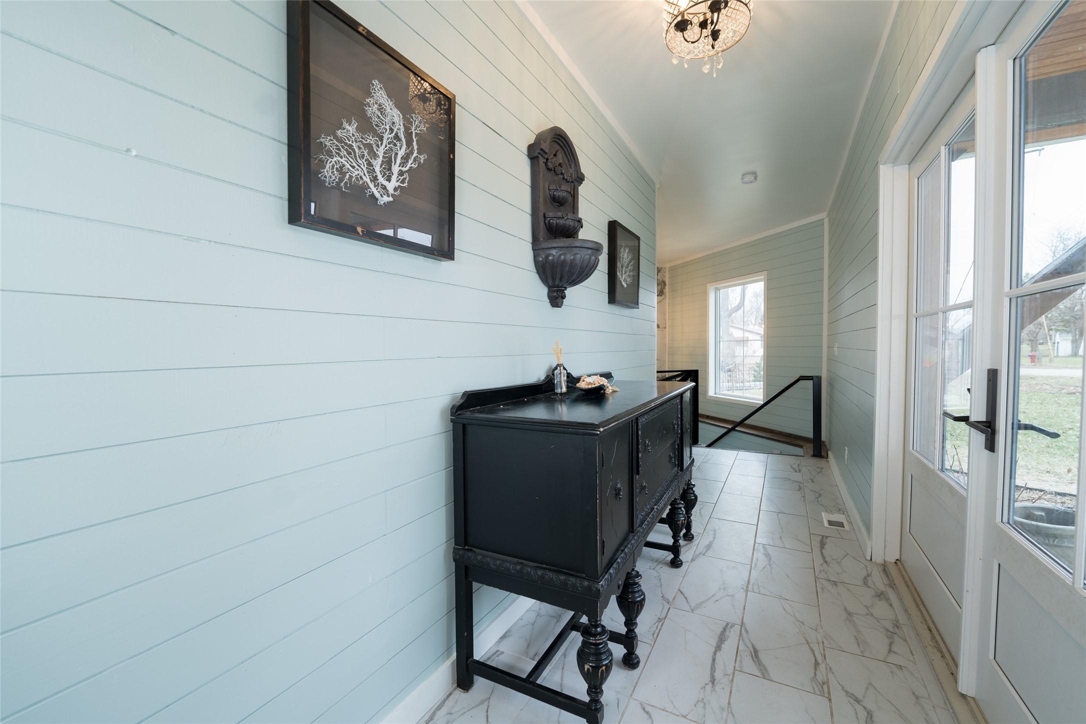 Image 4: Main entrance w/double doors and granite floors.