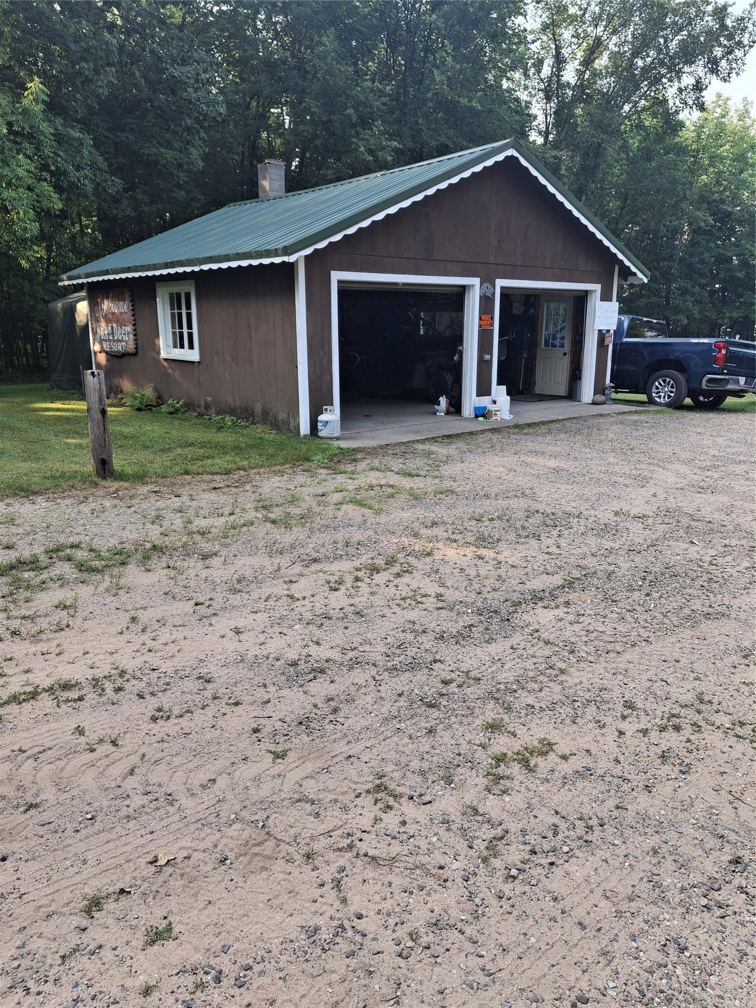 Image 3: Front view garage and work shop adjacent to vacant