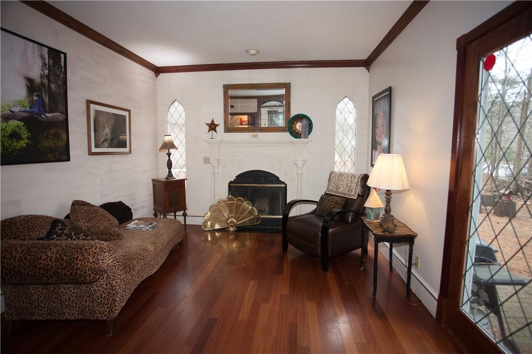 Image 2: Living Room with Wood Burning Fireplace