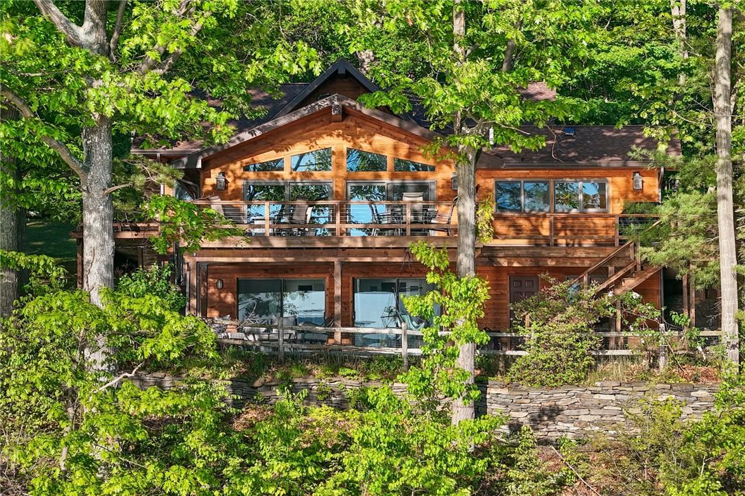 Image 1: Stunning Lake Home In The Woods.
