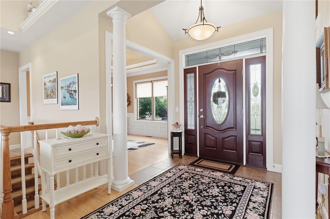 Image 3: Elegant front foyer featuring sophisticated archit