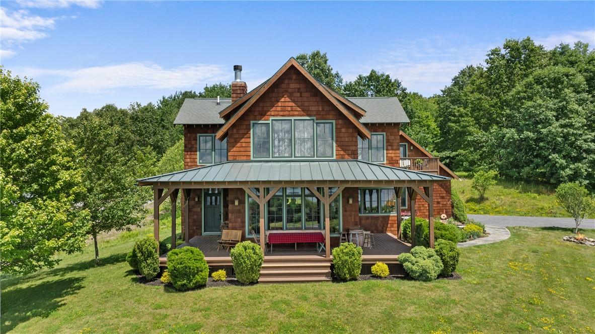 Image 3: Cedar shake siding with a mix of metal standing se