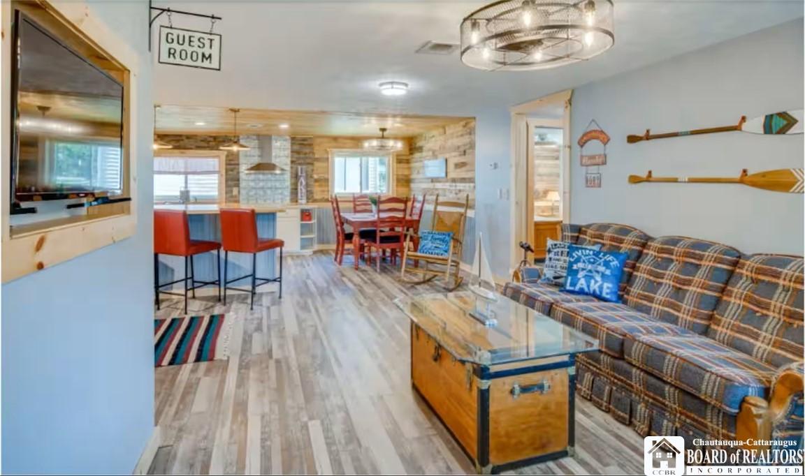 Image 4: Open concept - Living room, dining and kitchen are
