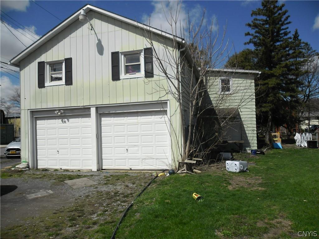 Image 4: Sideview of home with 2 car garage and additional