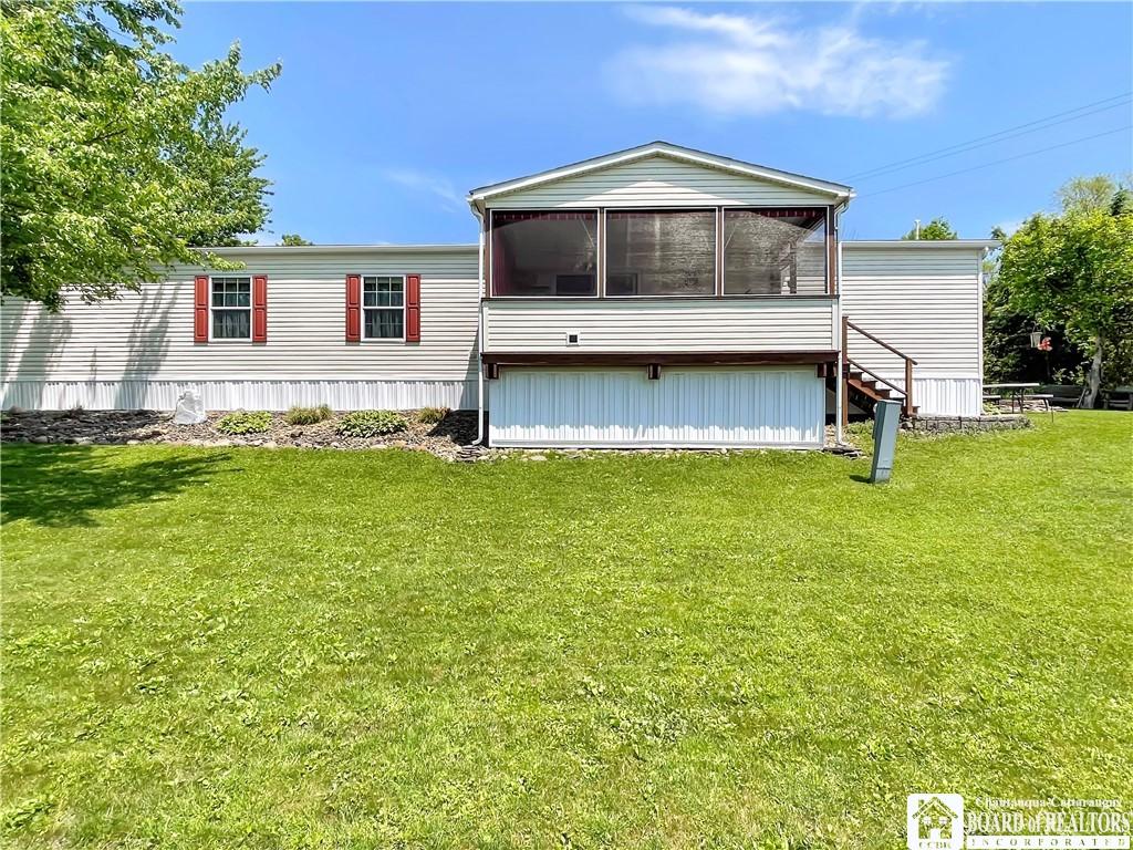 Image 3: Large covered and screened in lake facing porch.