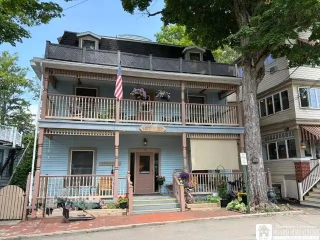 Image 1: Welcome to the Longfellow!  Large stacked porches,