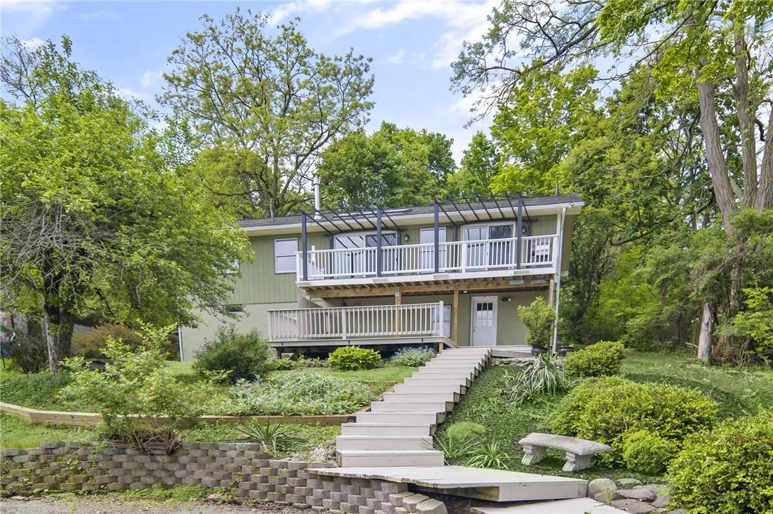Image 1: Back of home facing the lake