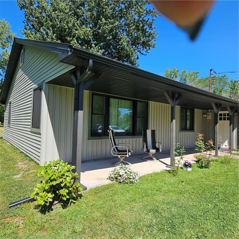 Image 4: Front of House - Open Covered Porch