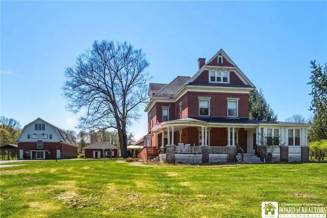 Image 1: The stately turn-of-the-century brick home has had