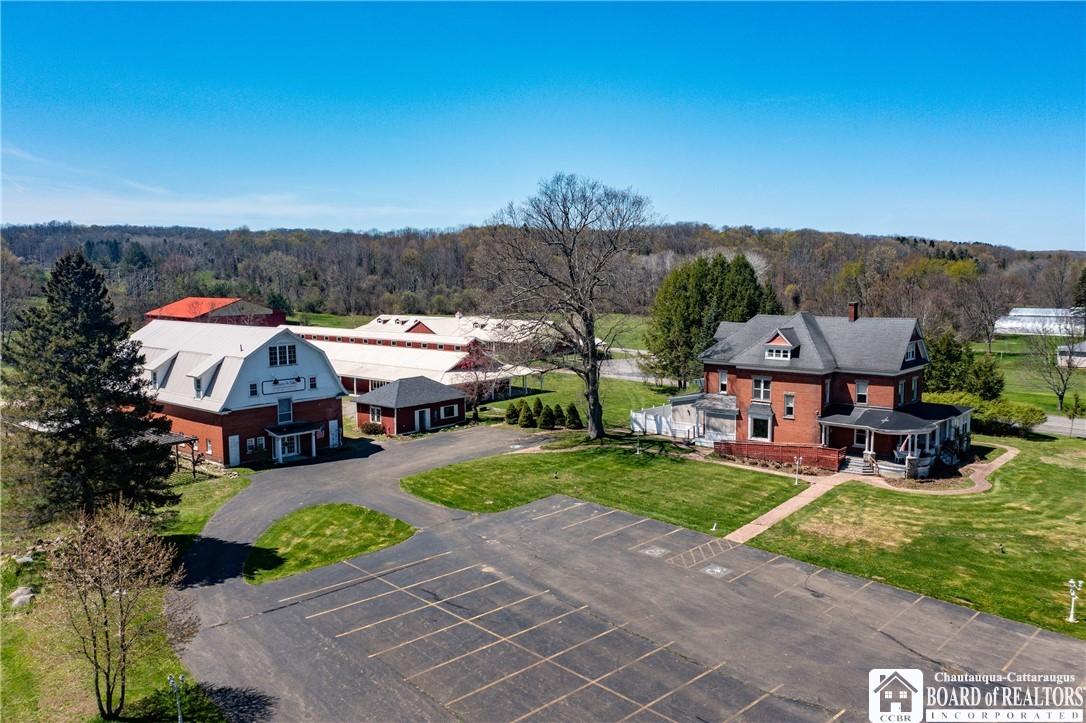 Image 2: Paved driveways with ample parking lead to the cen