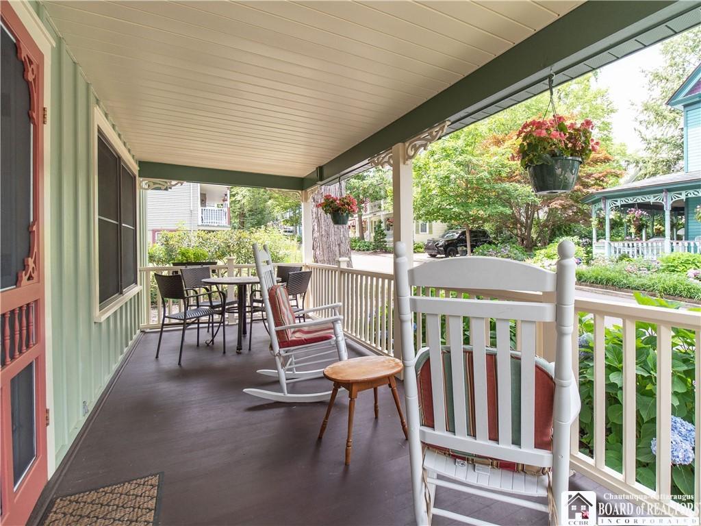 Image 4: Generous front porch with wonderful neighborhood v