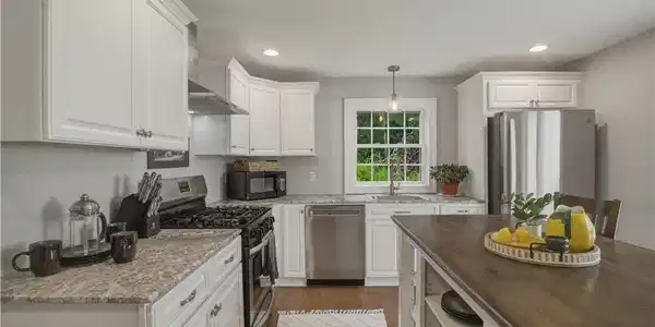 Image 3: The well appointed kitchen features a new dishwash