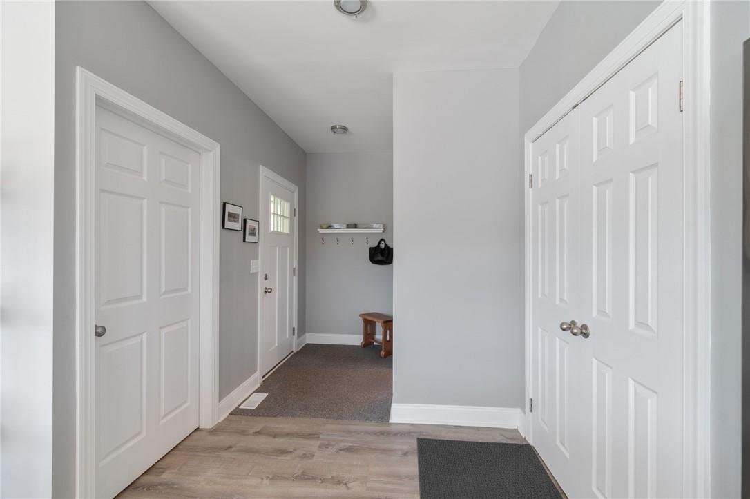 Image 3: Entranceway, left to basement 2 doors right pantry