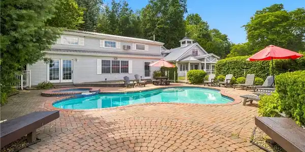 Image 2: with waterfront pool, spa, and fire pit