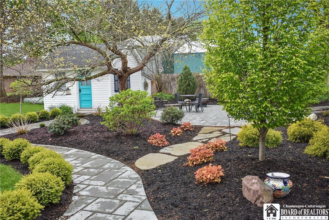 Image 3: Beautiful, landscaped walkway leads to a private p