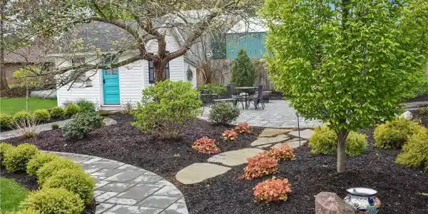 Image 3: Beautiful, landscaped walkway leads to a private p