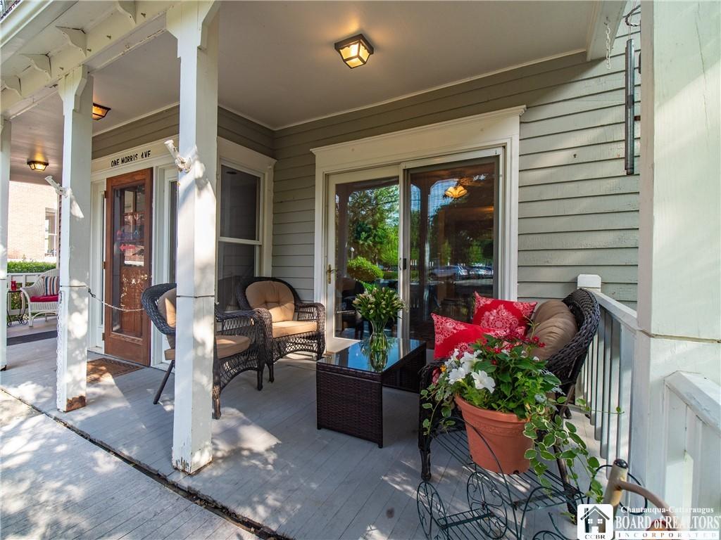 Image 4: The front porch has room for you to add more seati